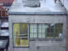 This is a view of the photo studio next door.  You can see the reflector; however, the other windows are fogged so we can't see what the subject is.  Hmmmmmm :)